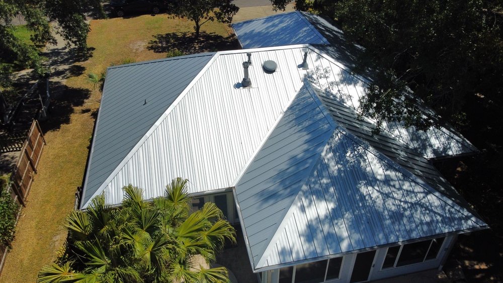 Aerial view of a finished standing-seam metal roof installed by New Horizon Roofing and Exteriors
